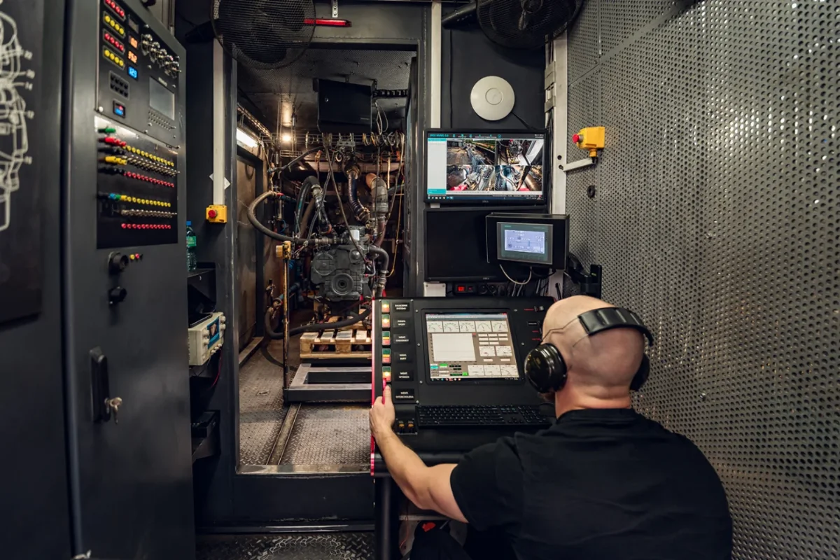 Technician at the engine dynamometer control desk during a diesel engine load test