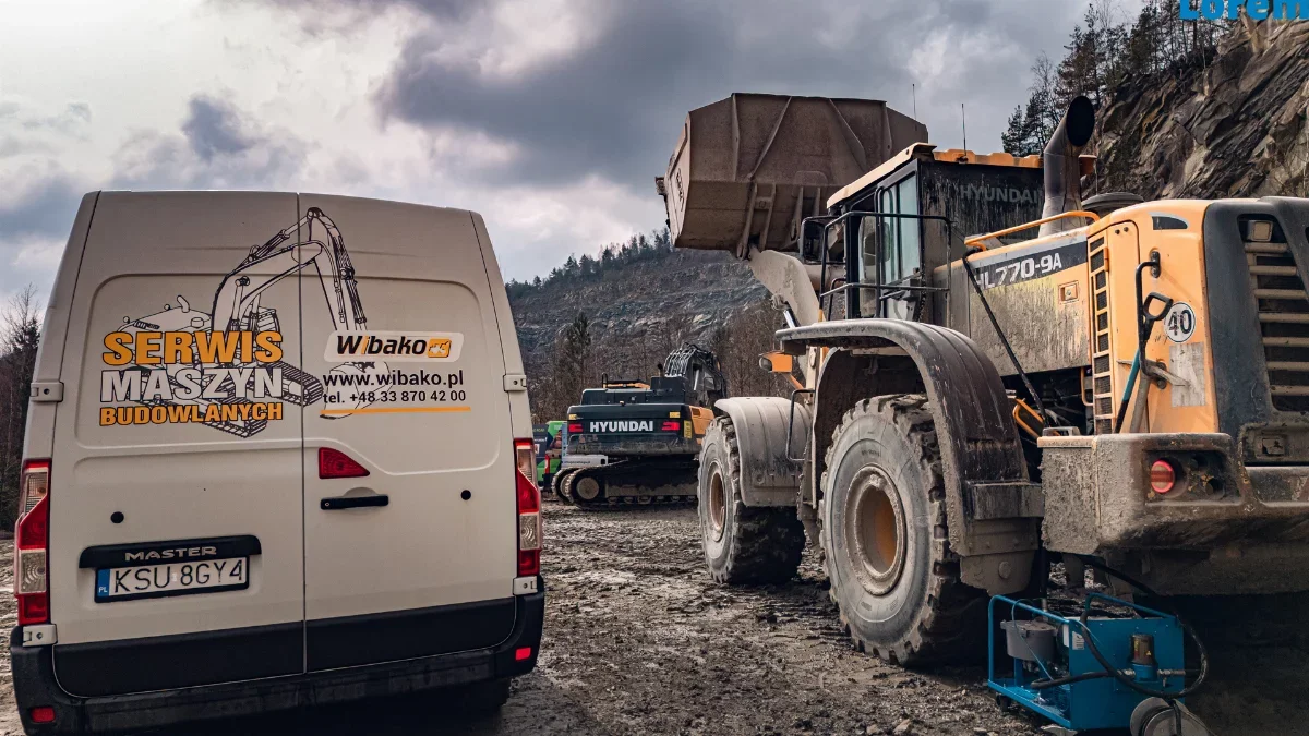 WIBAKO service van next to a Hyundai HL770-9A wheel loader in a quarry, with service equipment nearby and a Hyundai excavator in the background