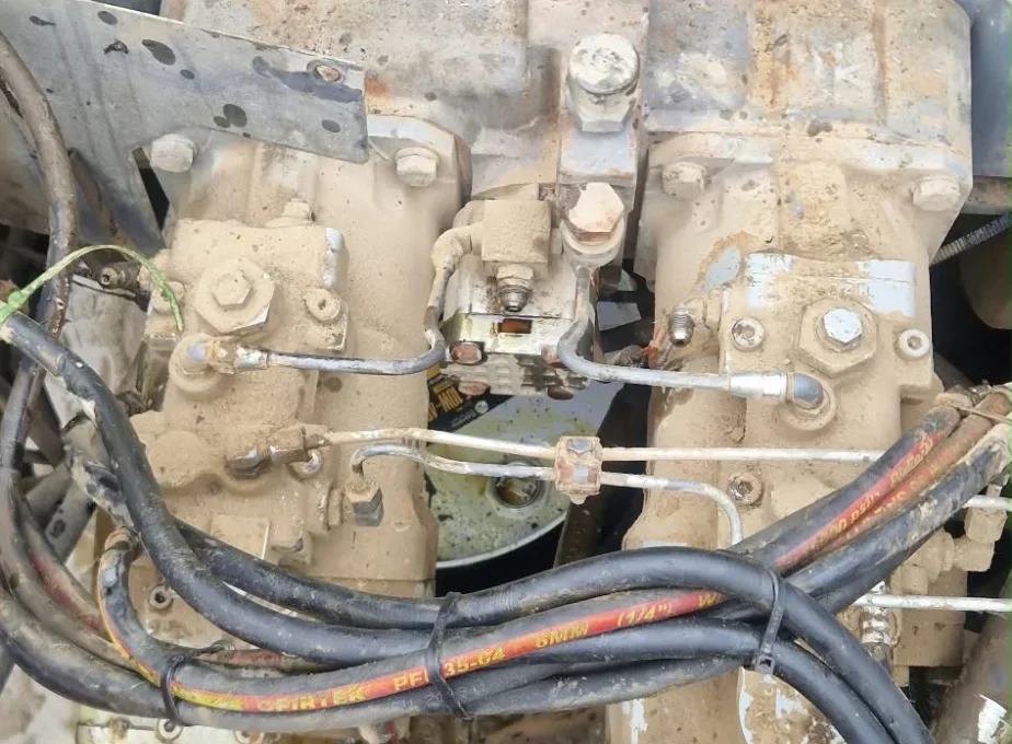 Tandem hydraulic pump mounted at the engine of a Hitachi ZX350LC-3 excavator, top view